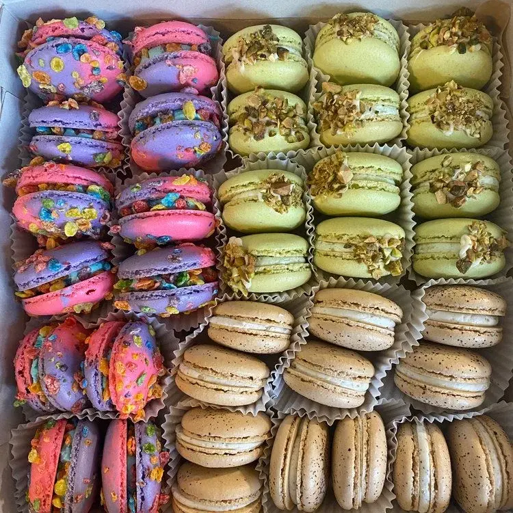 A collection of different colored macaroons.