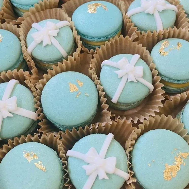 Macaroons created to look like a neatly wrapped present.